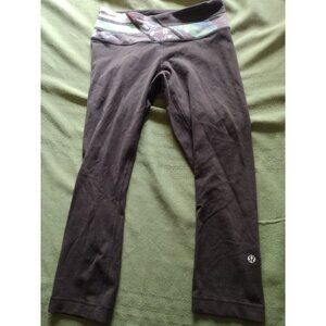 Lululemon Cropped Black leggings with Floral band. Size 4